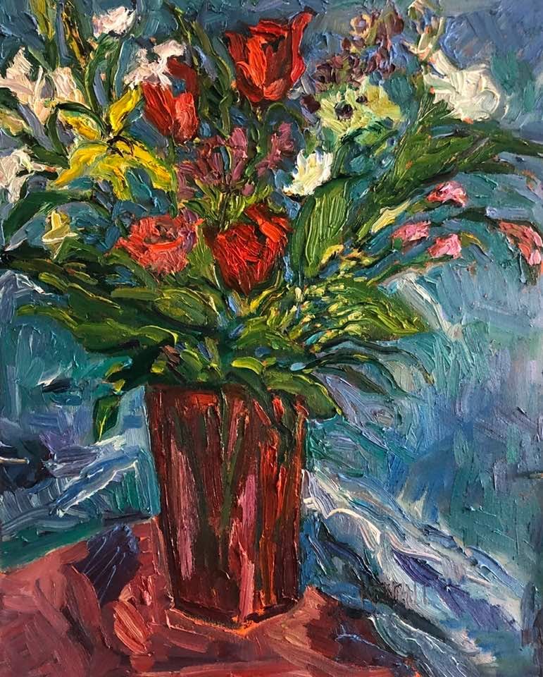 Red glass vase with flowers