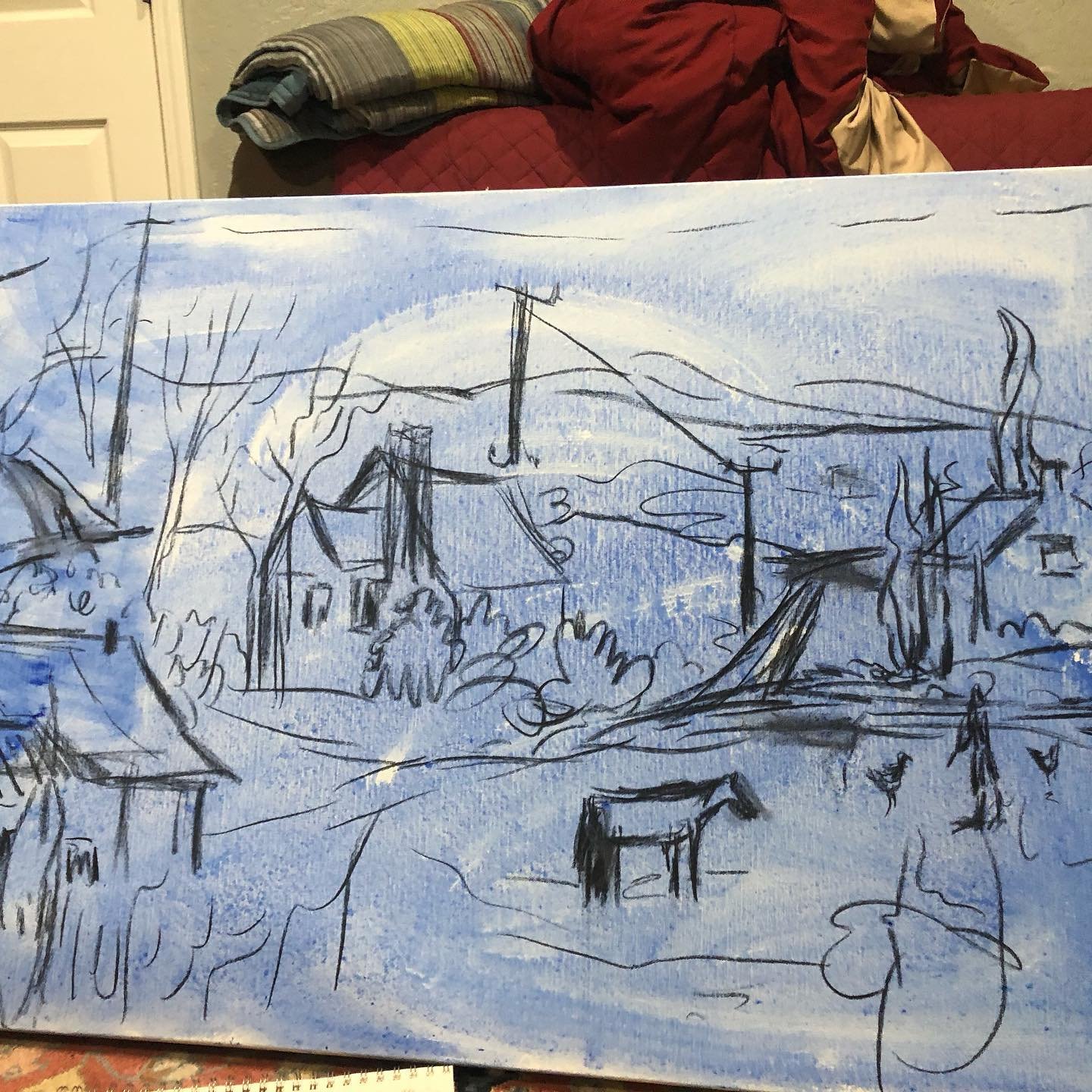 Charcoal sketch on canvas under painted with blue acrylic
